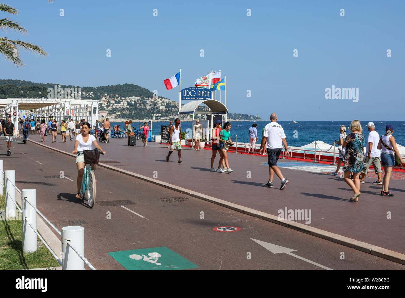 Incidental people on Promenades des Anglais beach boulevard in Nice, France Stock Photo