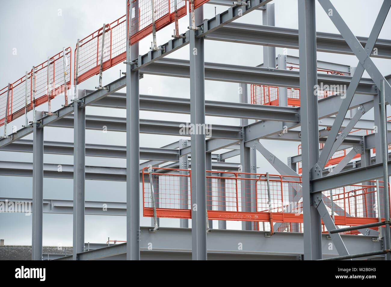 The construction of a large building with RSJs / rolled steel joists ...