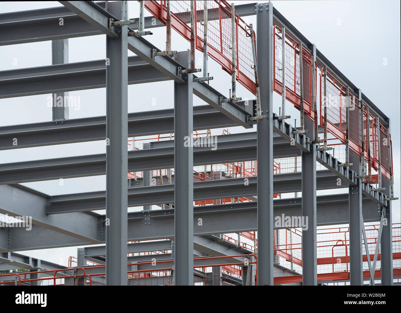 The construction of a large building with RSJs / rolled steel joists / steel girders. Stock Photo