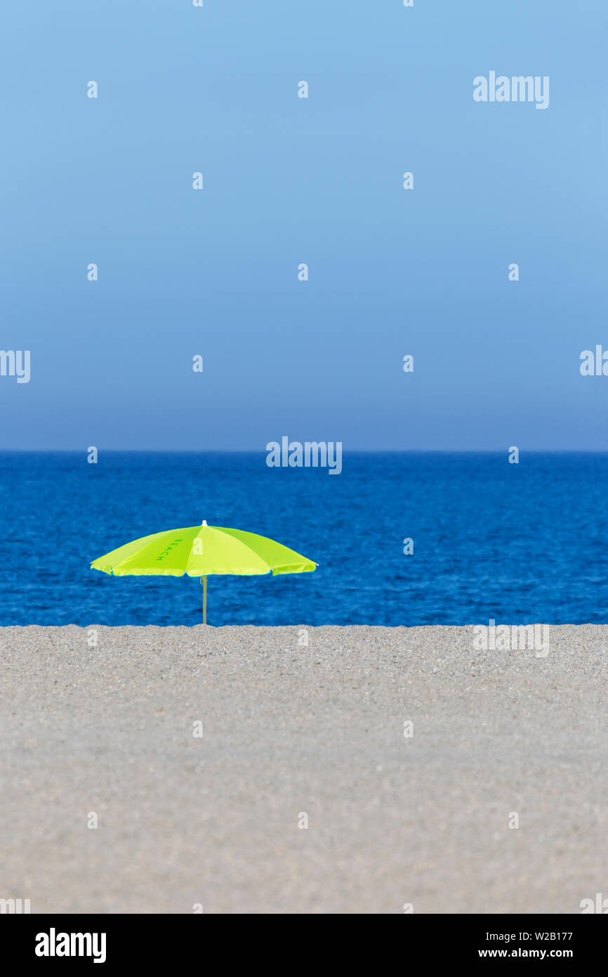 Green umbrella on beach Stock Photo Alamy