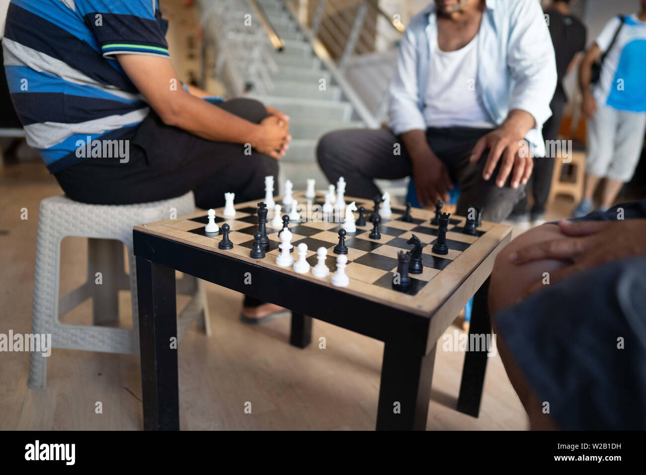 Samos, Samos, Greece. 28th June, 2019. Migrant play chess at a centre for residents on Samos.Samos Island is one of Europe's migrant hotspots acting as a reception and identification centre (RIC). It was established as a temporary accommodation site where migrants could be processed before moving to a refugee camp on the mainland. However, due to the continued number of arrivals, the mainland camps are full and so migrants are being left at the islands. The conditions are inhuman as the Central Government has for several years ignored requests from the municipality for assistance for the i Stock Photo