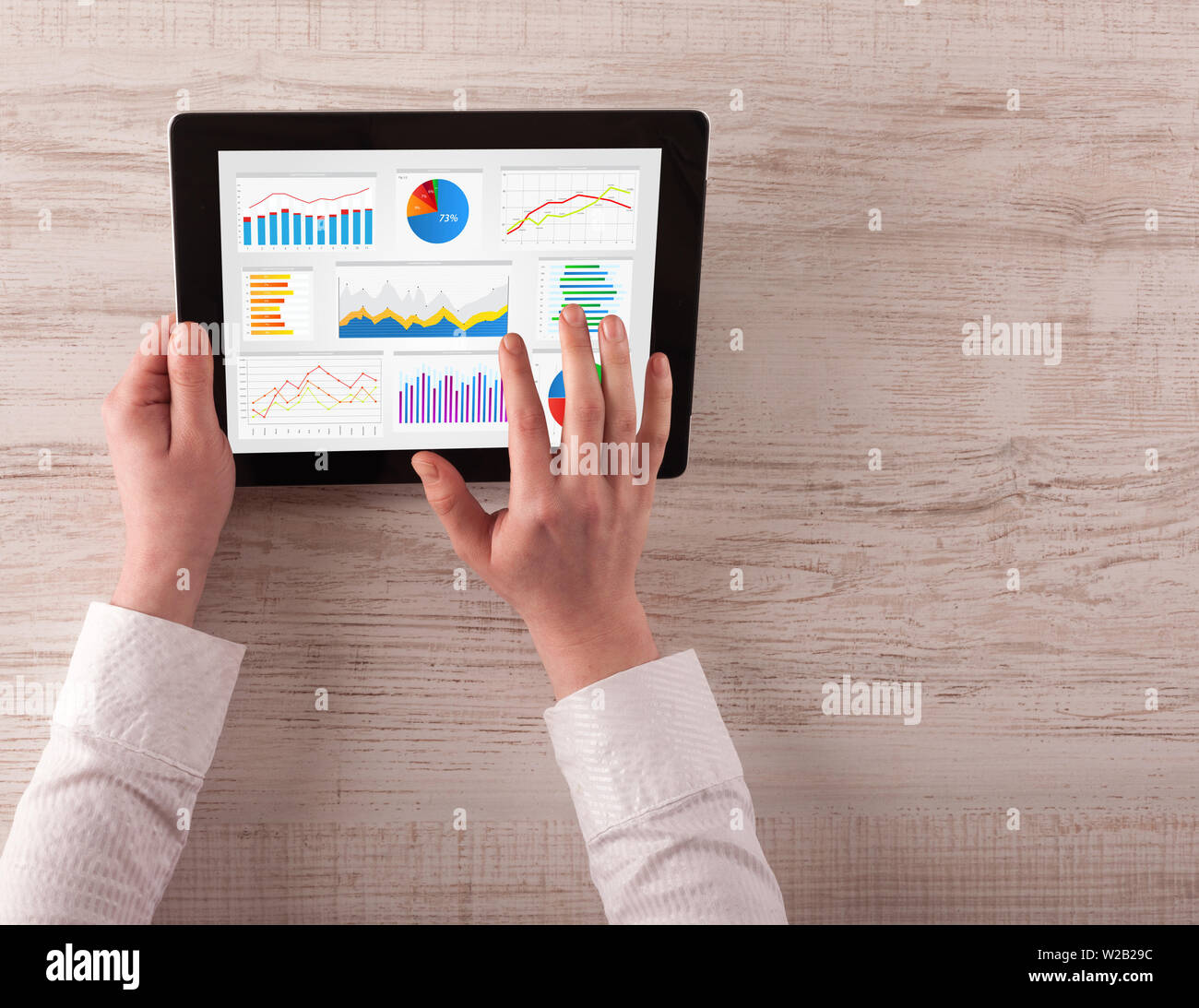 Hand making diagrams and charts on tablet Stock Photo - Alamy