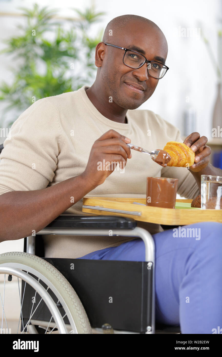 relaxed handsome man having breakfast Stock Photo