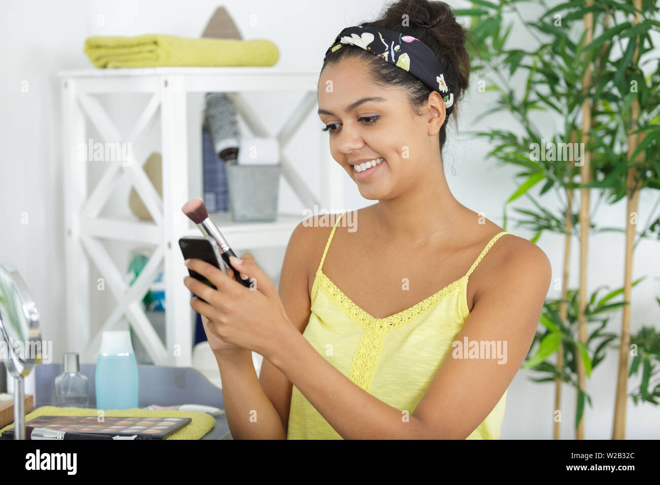 Teen girl applying lipstick hi-res stock photography and images - Alamy