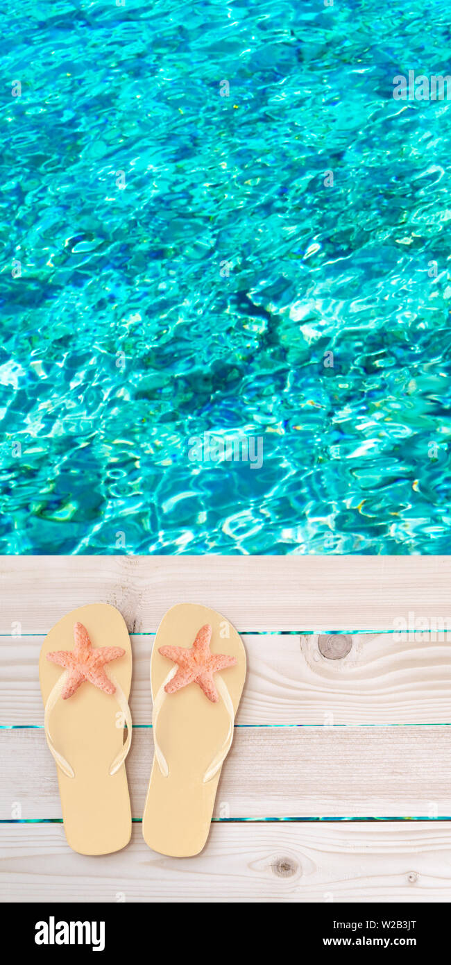 Flip flops with starfish on the wooden planks decking above the sea blurred background. Tropical island paradise.  Bright turquoise ocean water. Dream Stock Photo