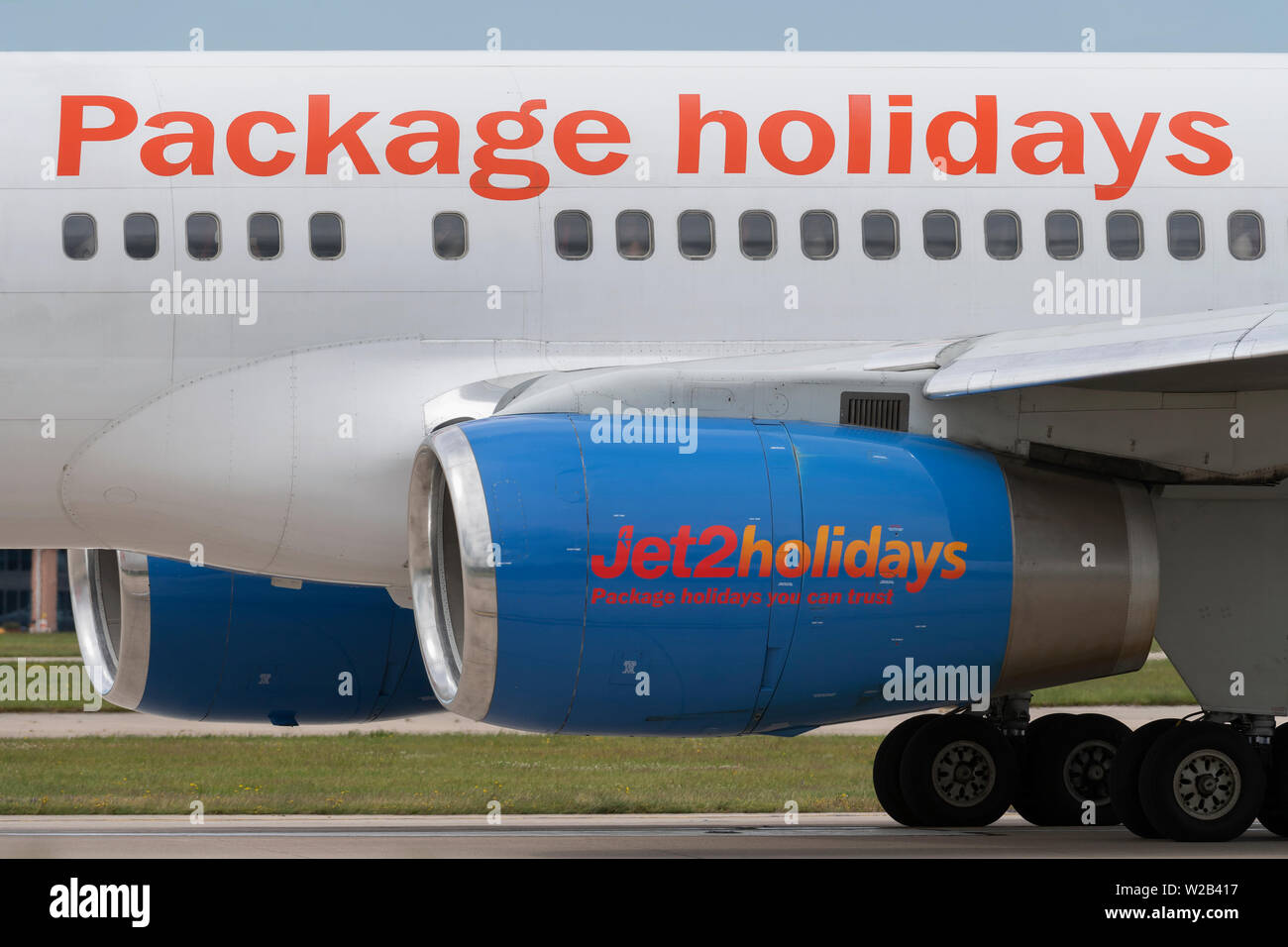 The logo of Jet 2 Holidays is clearly seen on the side of an air inlet at Manchester Airport, UK. Stock Photo