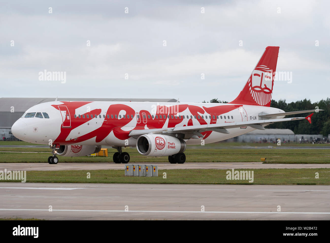 An Ernest Airbus A320-200 taxis on the runway at Manchester Airport, UK. Stock Photo