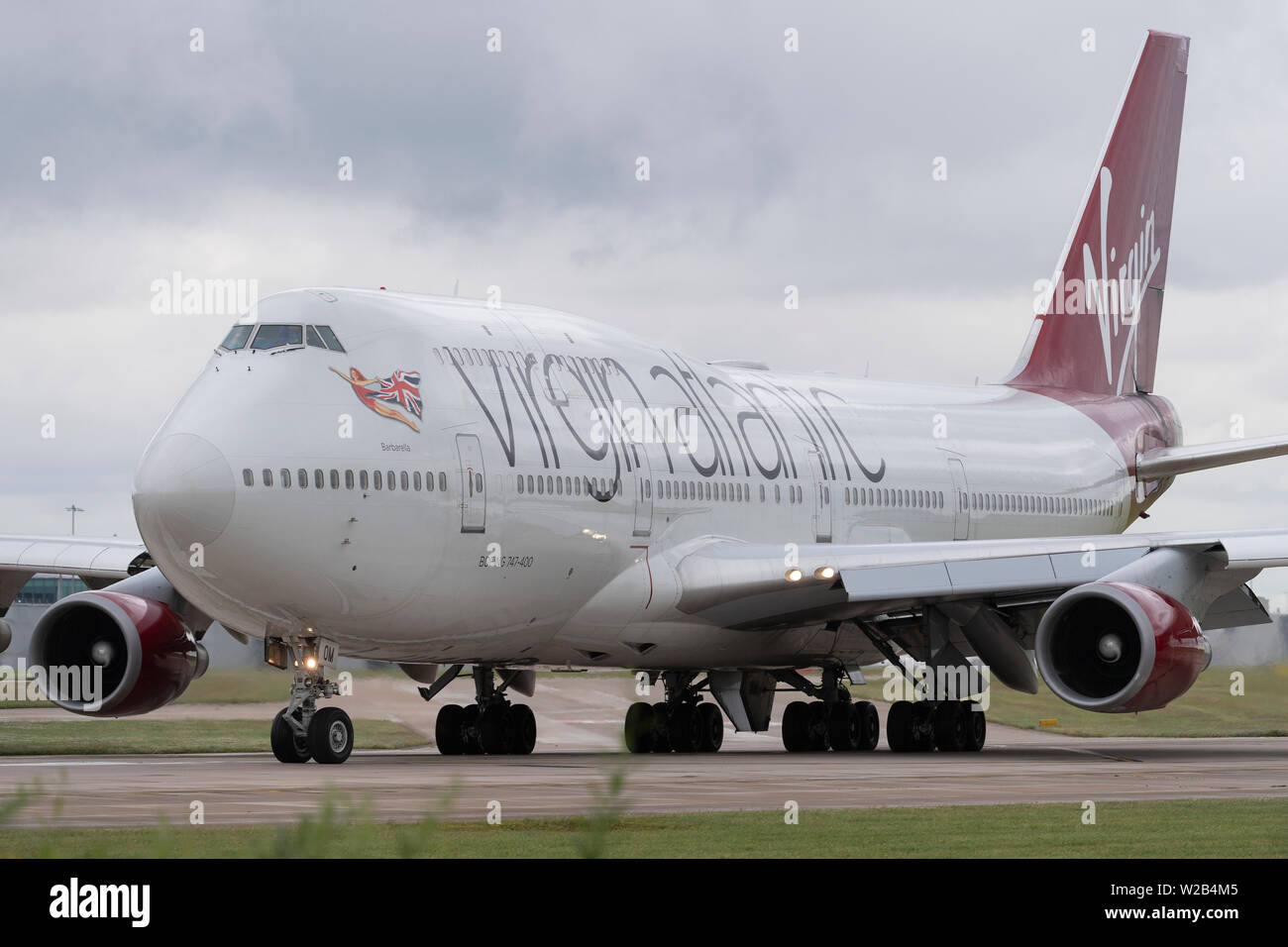 A Virgin Atlantic Boeing 747-400 taxis on the runway at Manchester Airport, UK. Stock Photo