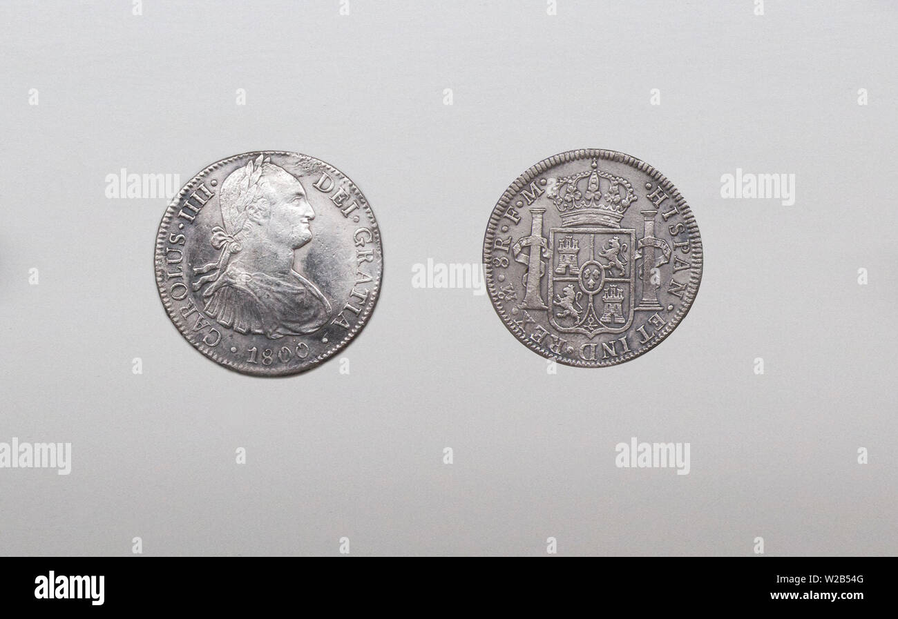 Cartagena, Spain - September 14th, 2018: Silver spanish pieces of eight or Charles III, minted in Mexico, 1796. ARQUA Museum, Spain Stock Photo