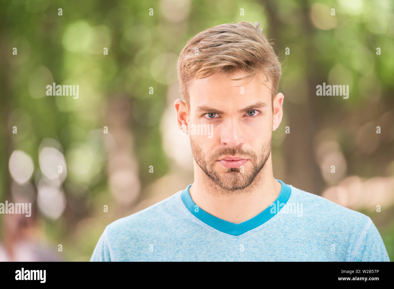 Charming Confidence Blond Man Man With Unshaved Mustache And Beard Hair With Stylish Haircut Handsome Man In Casual Tshirt On Blurred Natural Background Caucasian Man On Summer Day Stock Photo Alamy