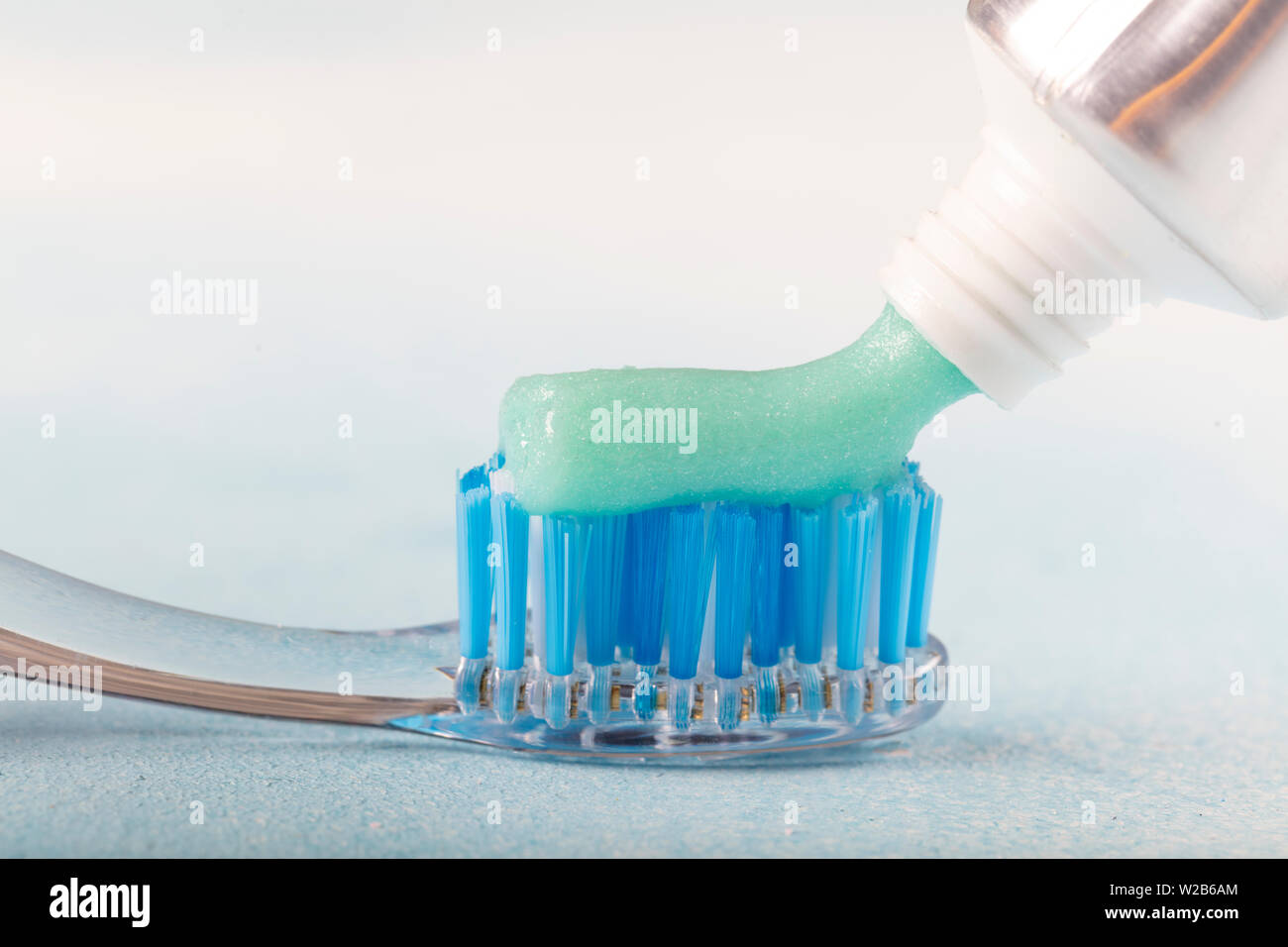 toothbrush on the table with toothpaste and toothpaste tube on blurred ...