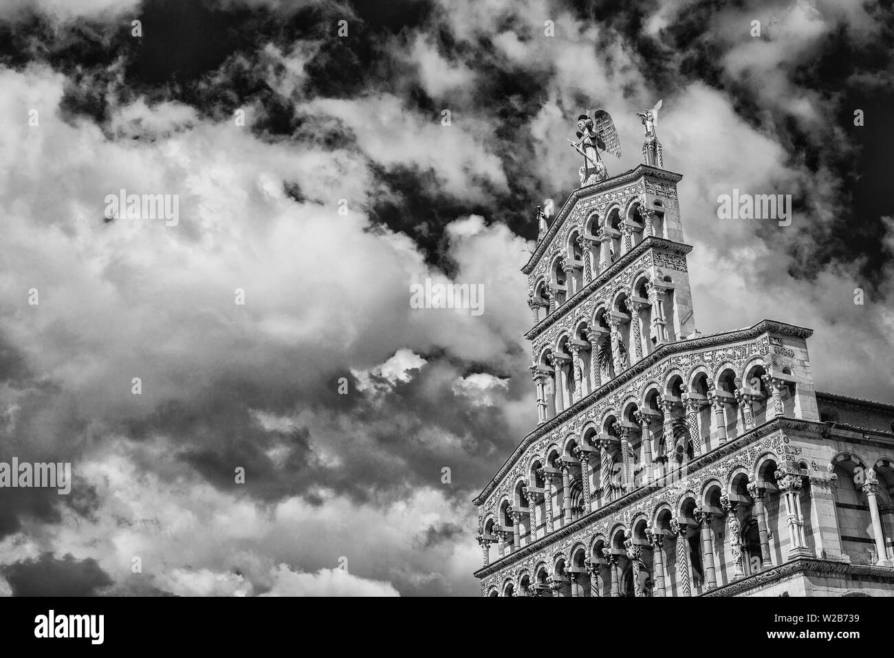 Saint Micheal in Foro Church beautiful medieval romanesque facade in the city of Lucca, Tuscany, erected in the 13th century (with clouds and copy spa Stock Photo