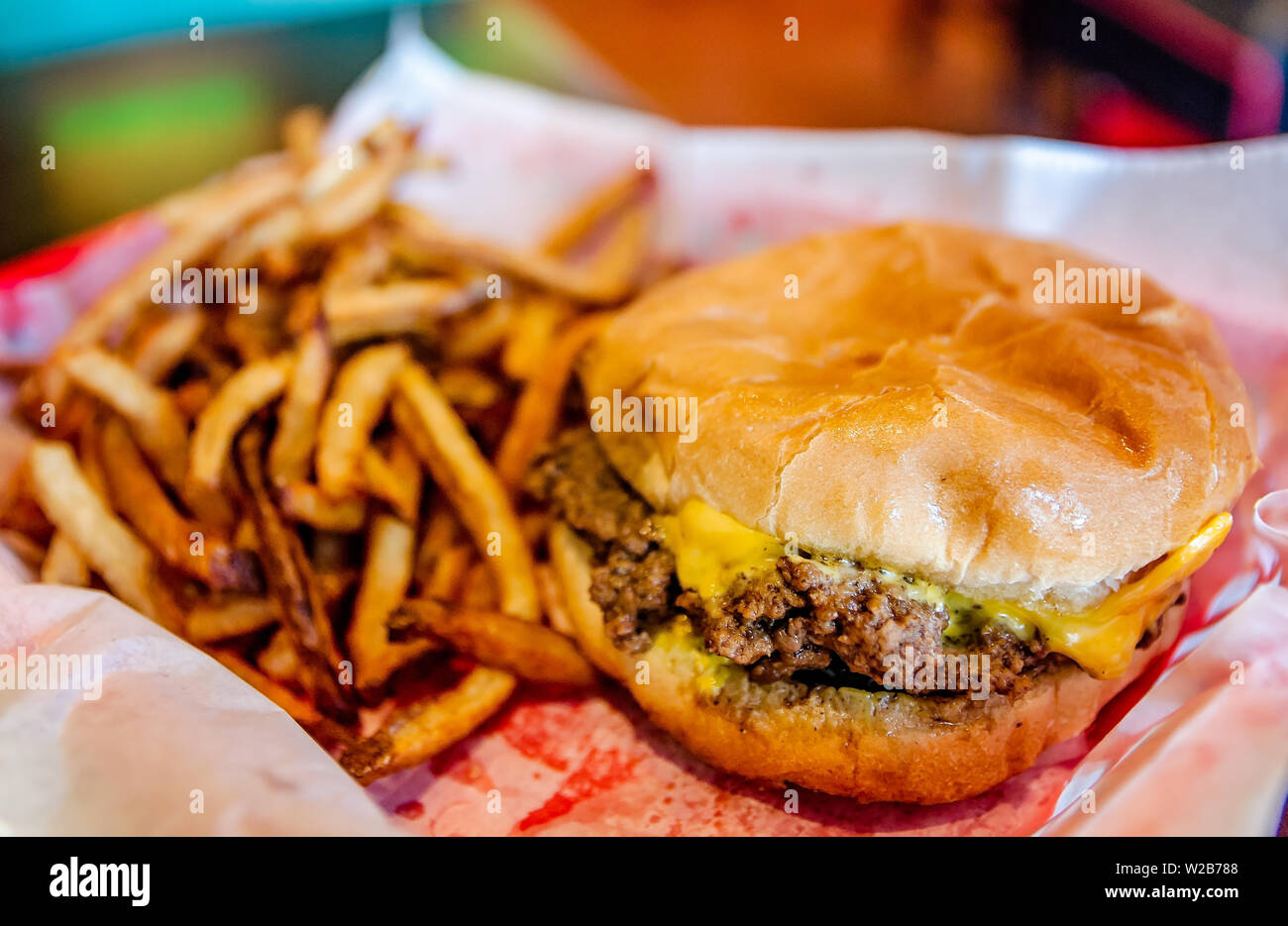 A cheeseburger and french fries is served in a basket at Dyer’s Burgers, Sept. 12, 2015, in Memphis, Tennessee. Dyer’s opened in 1912. Stock Photo