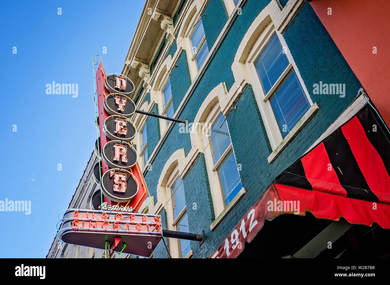 A neon sign hangs above Dyer’s Burgers on Beale Street, Sept. 12, 2015, in Memphis, Tennessee. Stock Photo