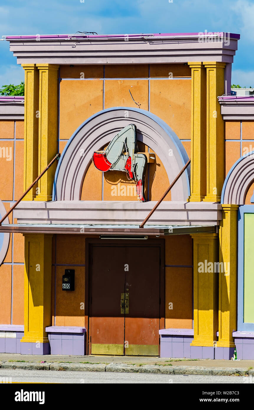A neon sign featuring a pair of legs hangs above the door of the Club Spectrum Drink-N-Drag, Sept. 12, 2015, in Memphis, Tennessee. Stock Photo