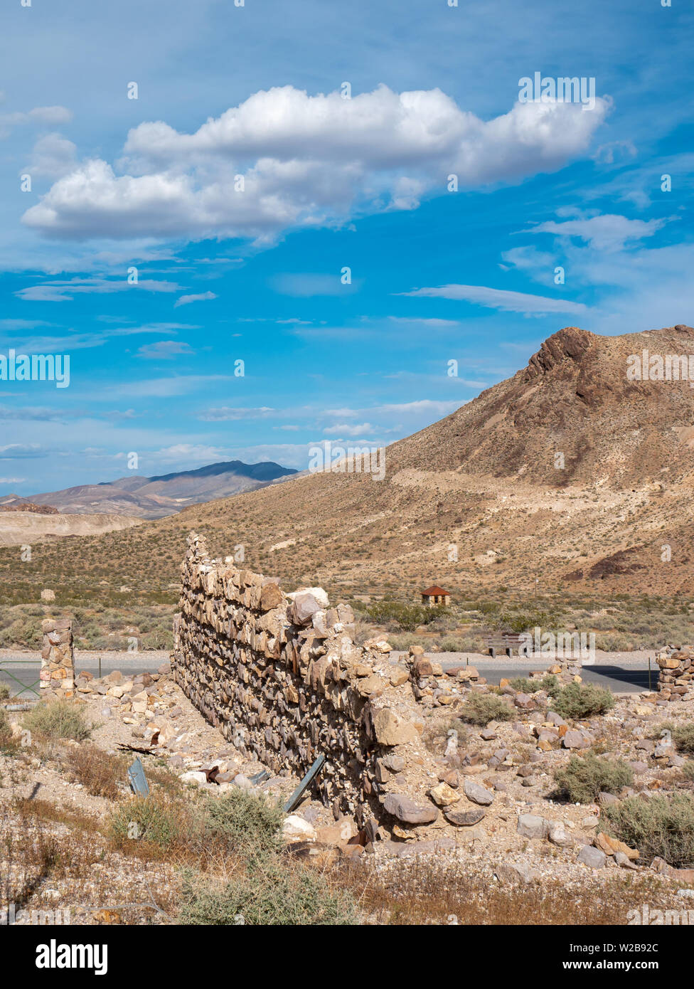 Remains of a stone wall in ruins of a building in the desert ghost town ...