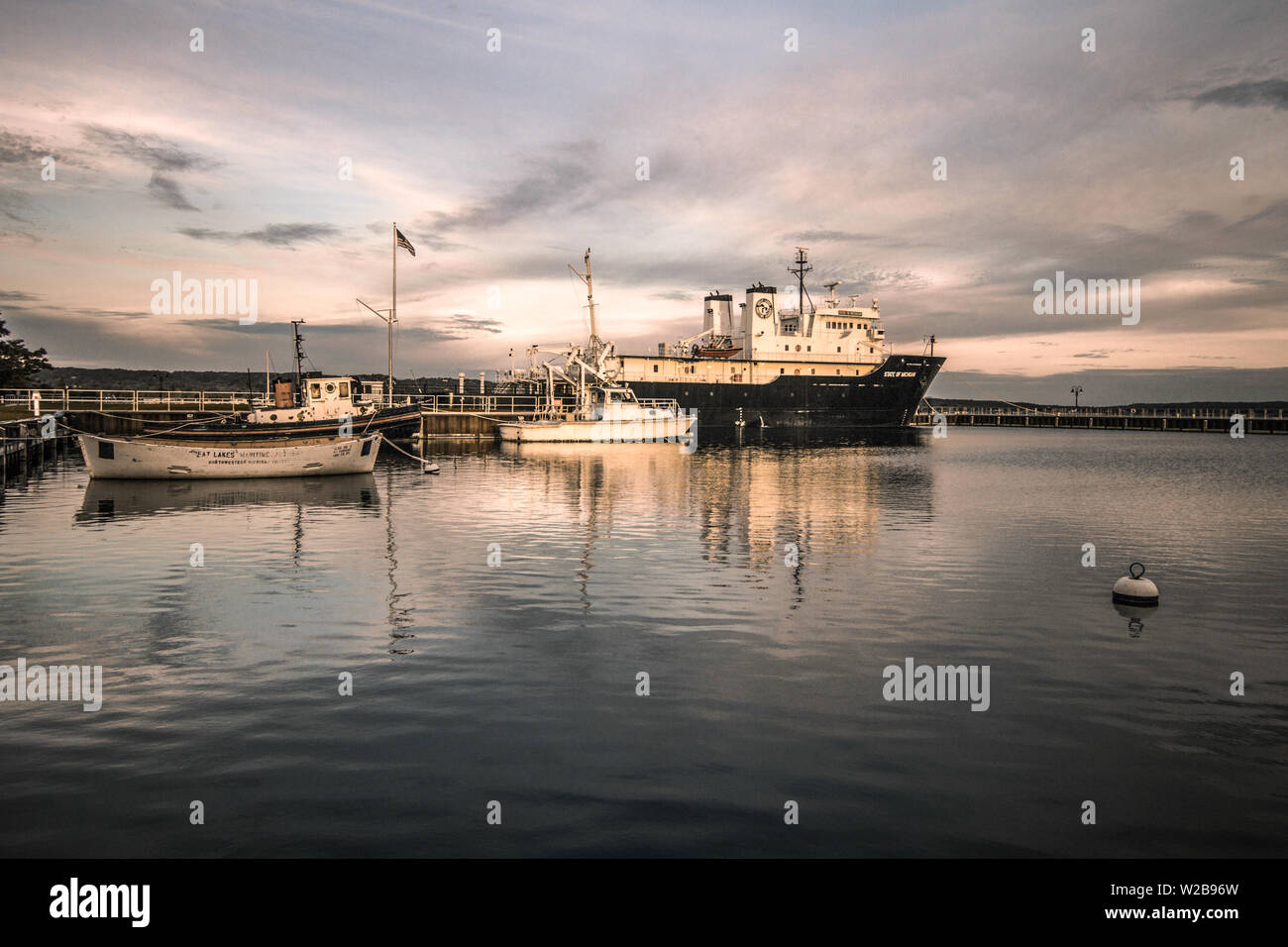 Harbor and research boats docked at Northern Michigan University. The university specializes in Great Lakes research and maritime careers. Stock Photo