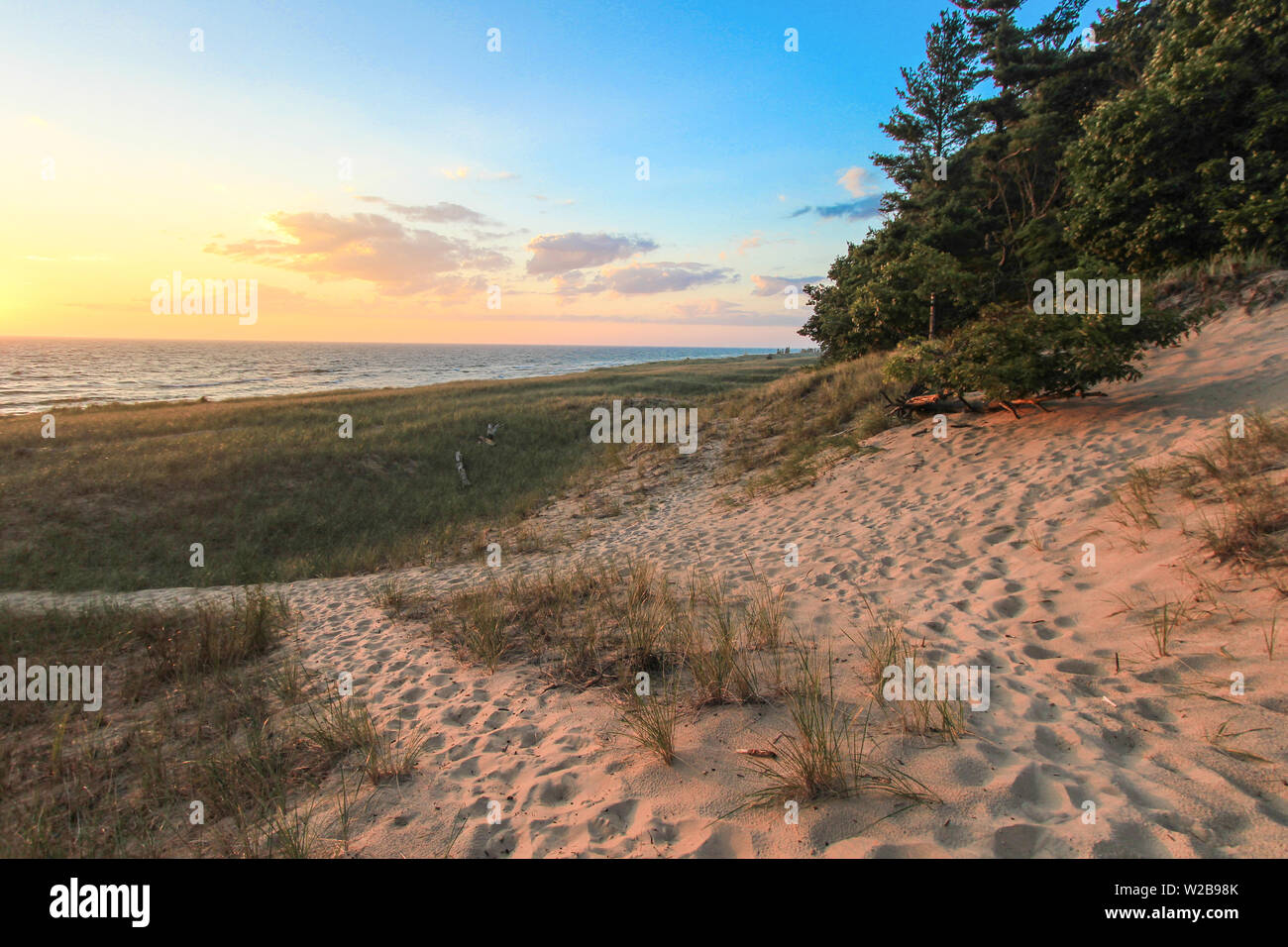 Beach Path. Winding path through dune grass and sand dunes on the shores of Lake Michigan. Hoffmaster State Park, Michigan Stock Photo
