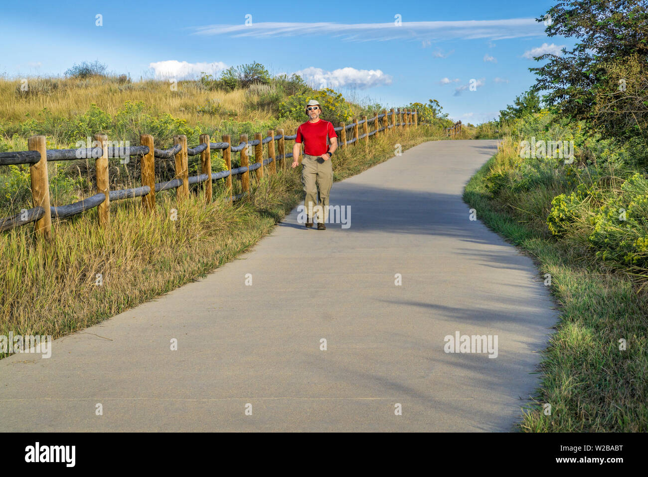 Senior Man Is Walking On The Poudre River Trail In Northern Colorado Near Windsor It Is A Paved Bike Trail Extending More Than Miles Between Timn Stock Photo Alamy