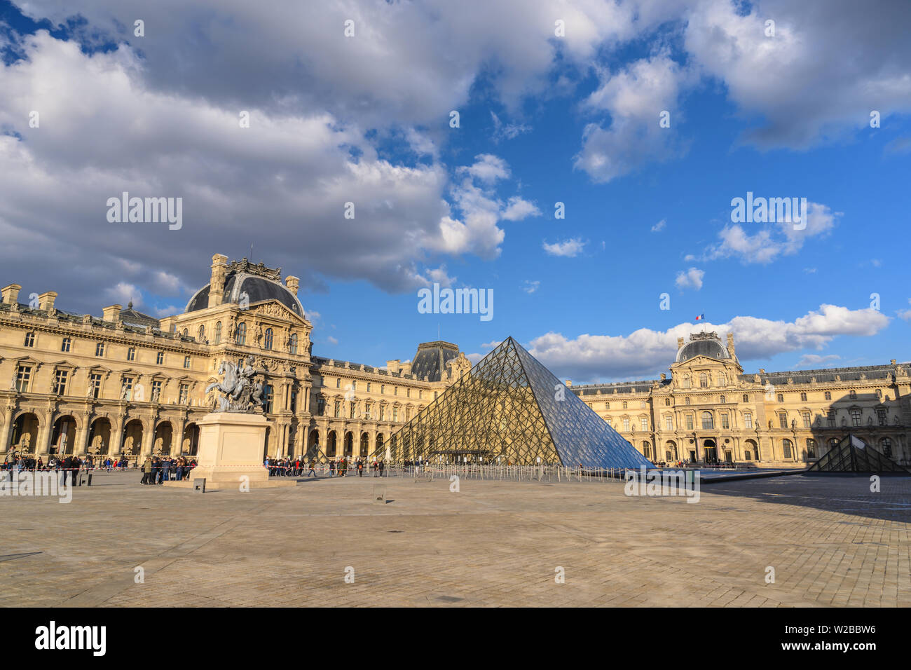 PARIS, FRANCE - APRIL 4, 2019: Paris France city skyline at Louvre Museum Pyramid Stock Photo