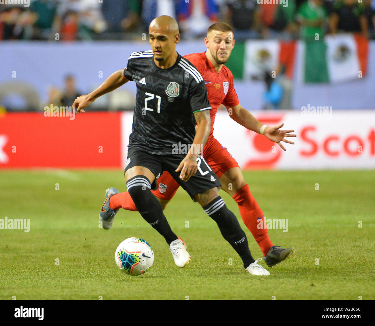 Chicago, IL, USA. 07th July, 2019. Mexico defender, Luis Rodriguez (21), moves the ball downfield as US midfielder, Michael Bradley (4), follows behind. during the 2019 CONCACAF Gold Cup, championship match, between the United States and Mexico, at Soldier Field in Chicago, IL. Credit: Kevin Langley/CSM/Alamy Live News Stock Photo