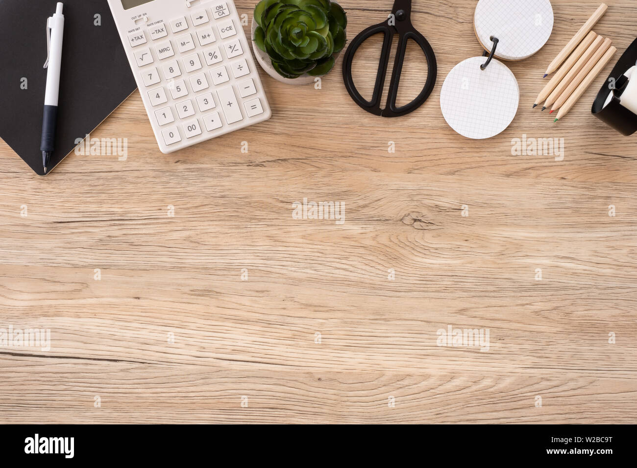 top view office stationery on wooden table with copy space.student stuff on desk.education concept Stock Photo
