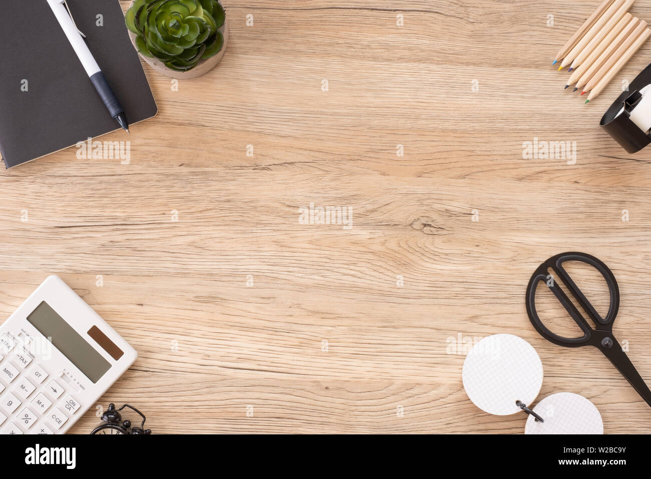 top view office stationery on wooden table with copy space.student stuff on desk.education concept Stock Photo