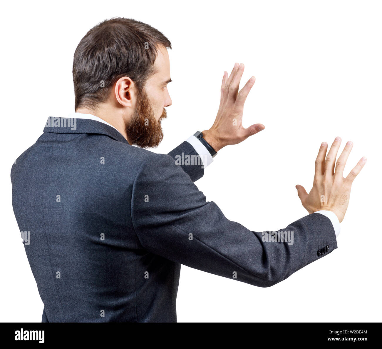 Businessman in suit shows outstretched hand withspread fingers. Stock Photo