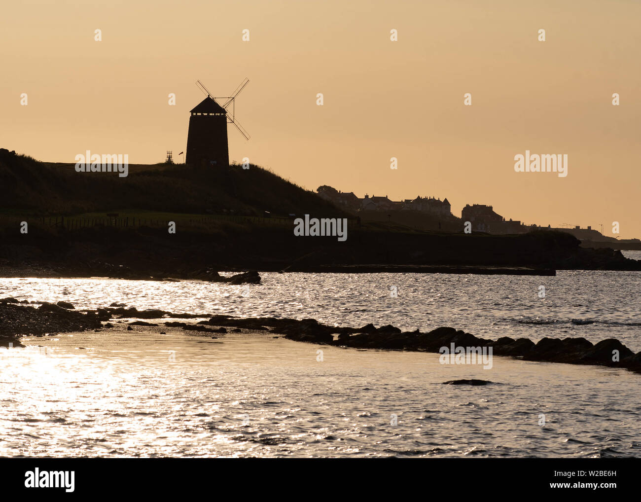 St Monans Windmill, St Monans, Fife, Scotland, UK. 8th July, 2019. UK weather - An idyllic early morning at St Monans Windmill, The East Neuk of Fife, Scotland. The windmill is one of the few reminders of the large scale salt production that took place here in the 18th century, when the windmill was used to pump sea water into the salt pans. Credit: Kay Roxby/Alamy Live News Stock Photo