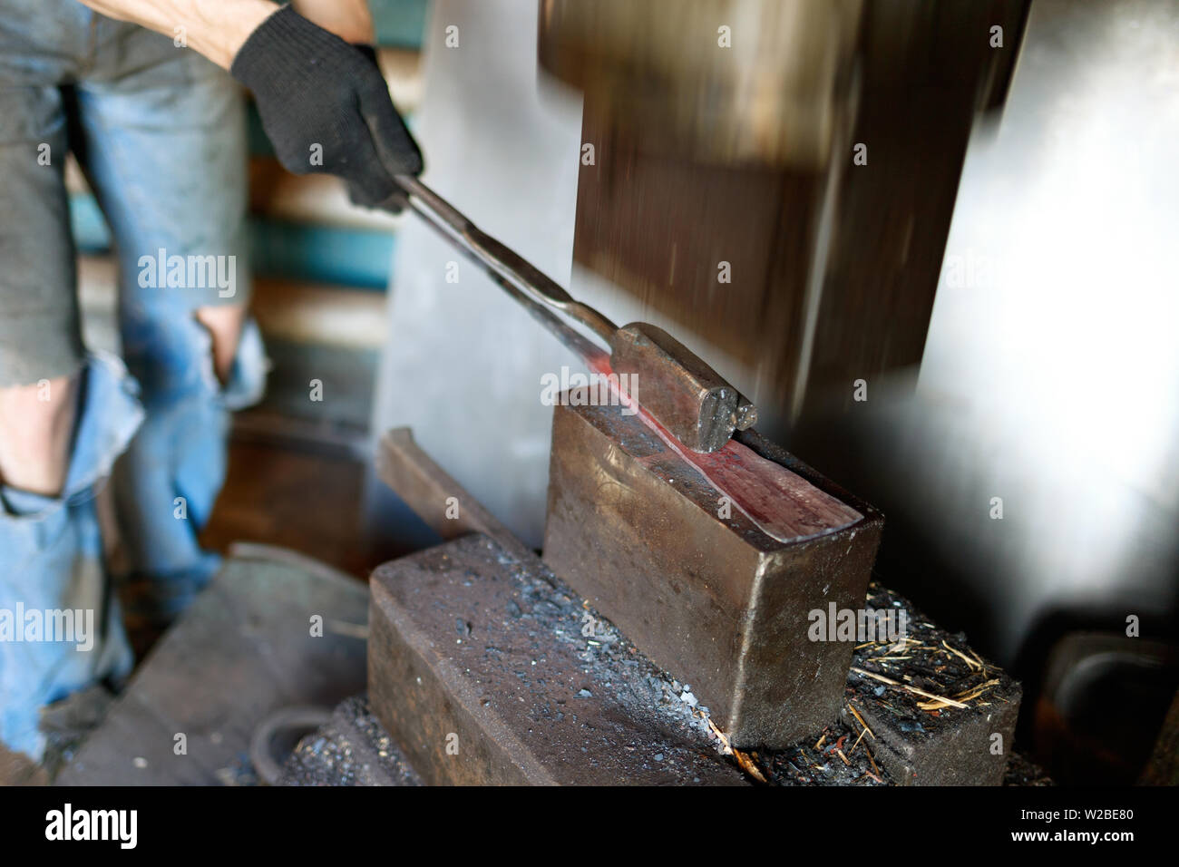 Blacksmith by using pneumatic hammer Stock Photo Alamy