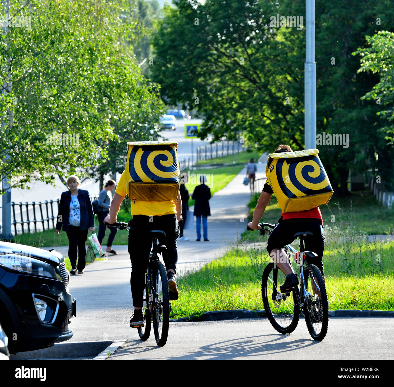 Couriers on bicycles. Stock Photo