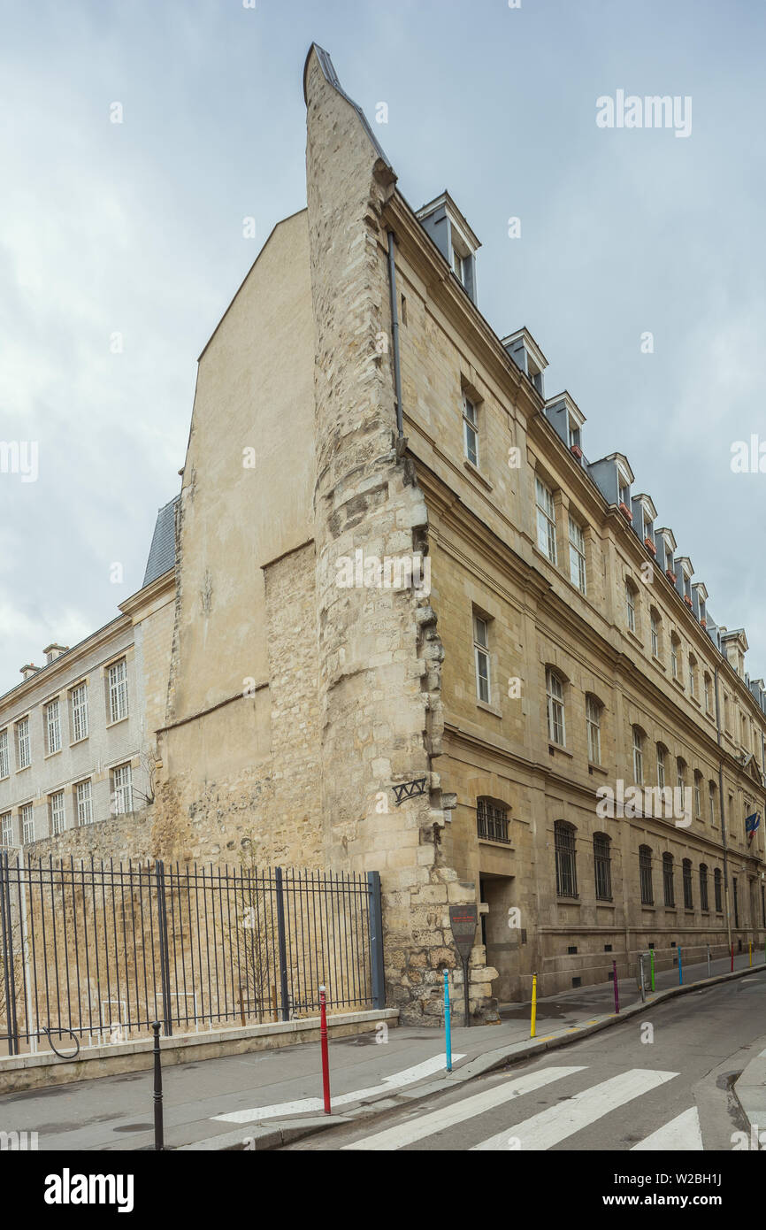 Remnants of the wall of King Philip II attached to a house block in Paris Stock Photo