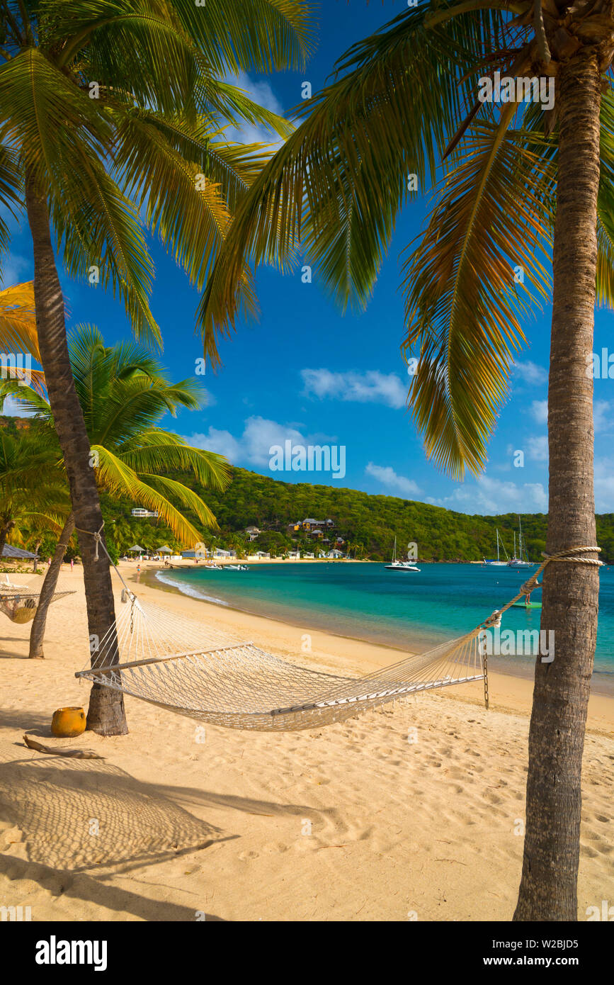 Caribbean, Antigua, Freeman's Bay, Galleon Beach, Hammock between Palm Trees Stock Photo