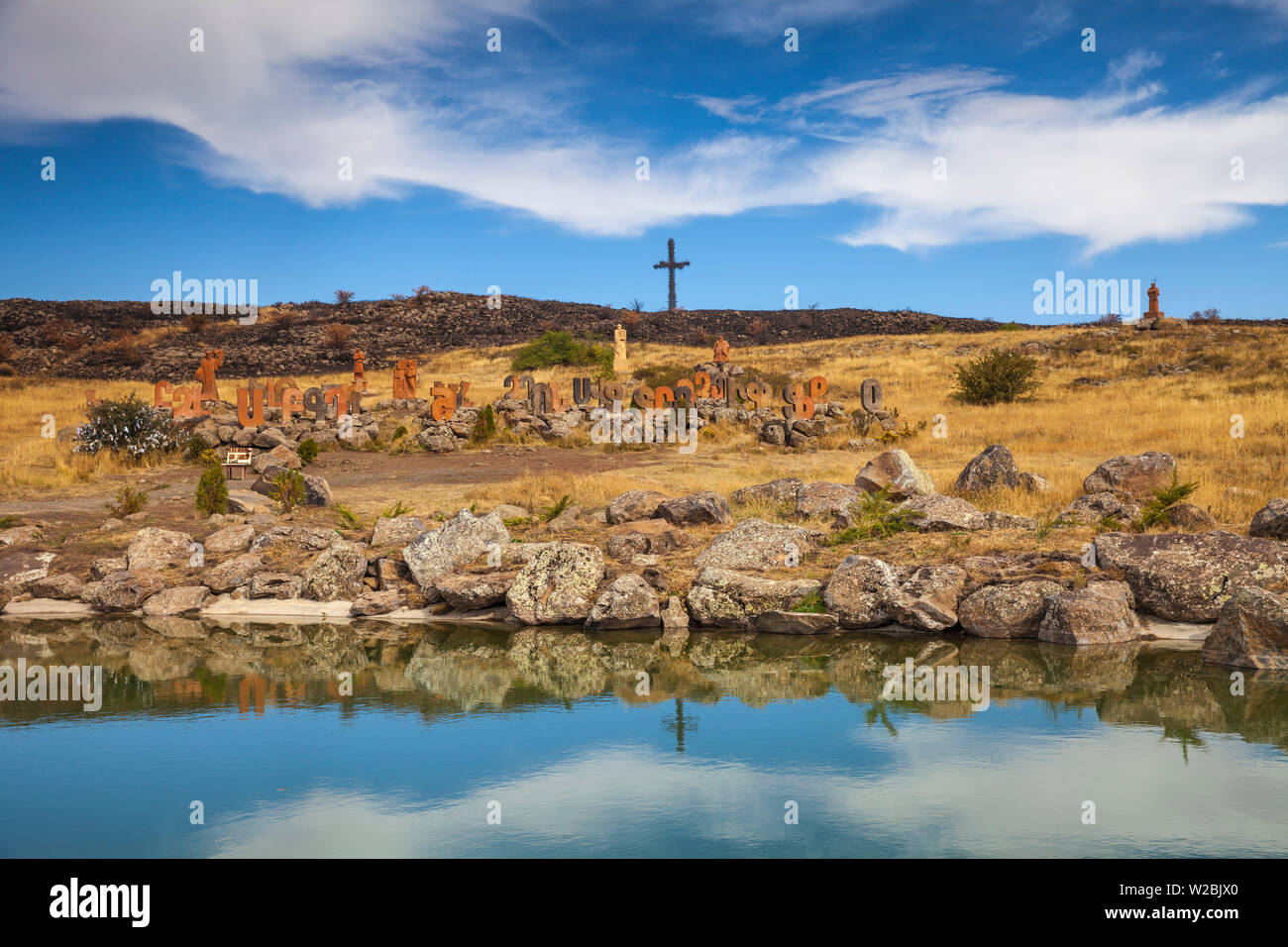 Armenia, Artashavan Village, Armenian alphabet monument - Giant stone letters dedicated to the founder of Armenia's alphabet, infront of Giant cross consisting of 1712 big and small crosses which symbolise Christianity as an official religion Stock Photo