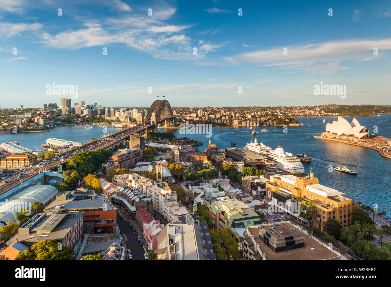 Australia, New South Wales, NSW, Sydney, The Rocks area, Sydney Harbour Bridge and Sydney Opera House, elevated view, late afternoon Stock Photo