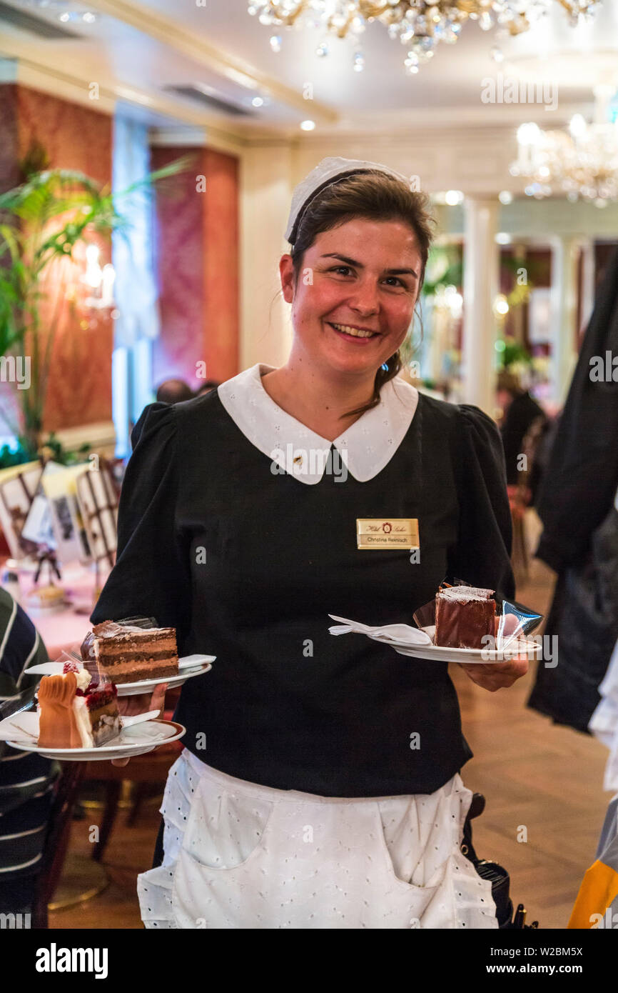 Waitress serving cakes, famous Cafe Sacher, Salzburg, Austria Stock Photo