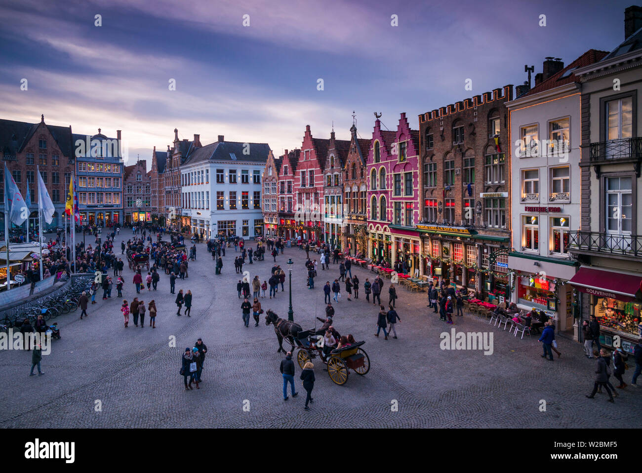 Belgium, Bruges, The Markt, elevated view of main square buildings, dusk Stock Photo