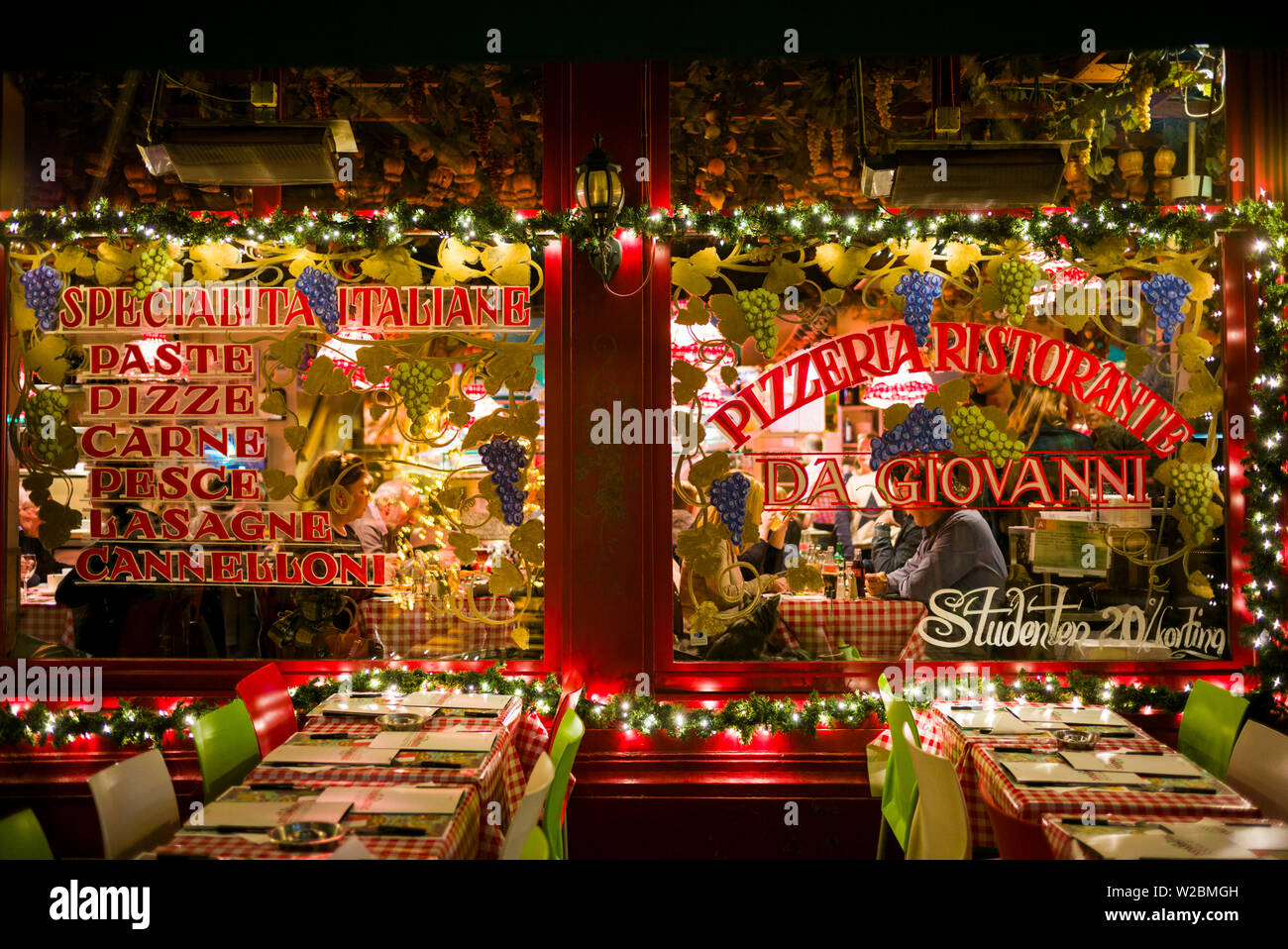 Belgium, Antwerp, Oude Kornmarkt street, restaurant, evening Stock Photo