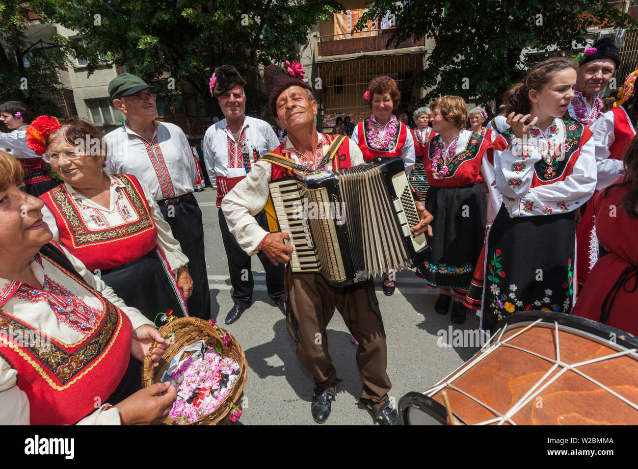 Bulgaria, Central Mountains, Kazanlak, Kazanlak Rose Festival, town produces 60% of the world's rose oil, Rose Parade, dancers and accordionist in traditional costumes, NR Stock Photo