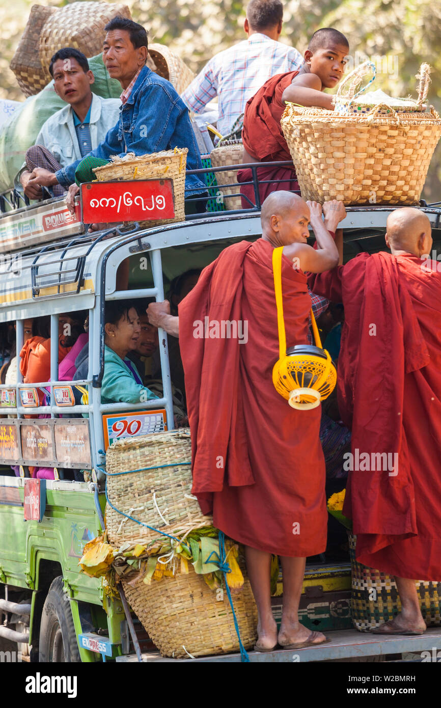 Monks on loaded mini-bus, Mandalay, Myanmar (Burma) Stock Photo