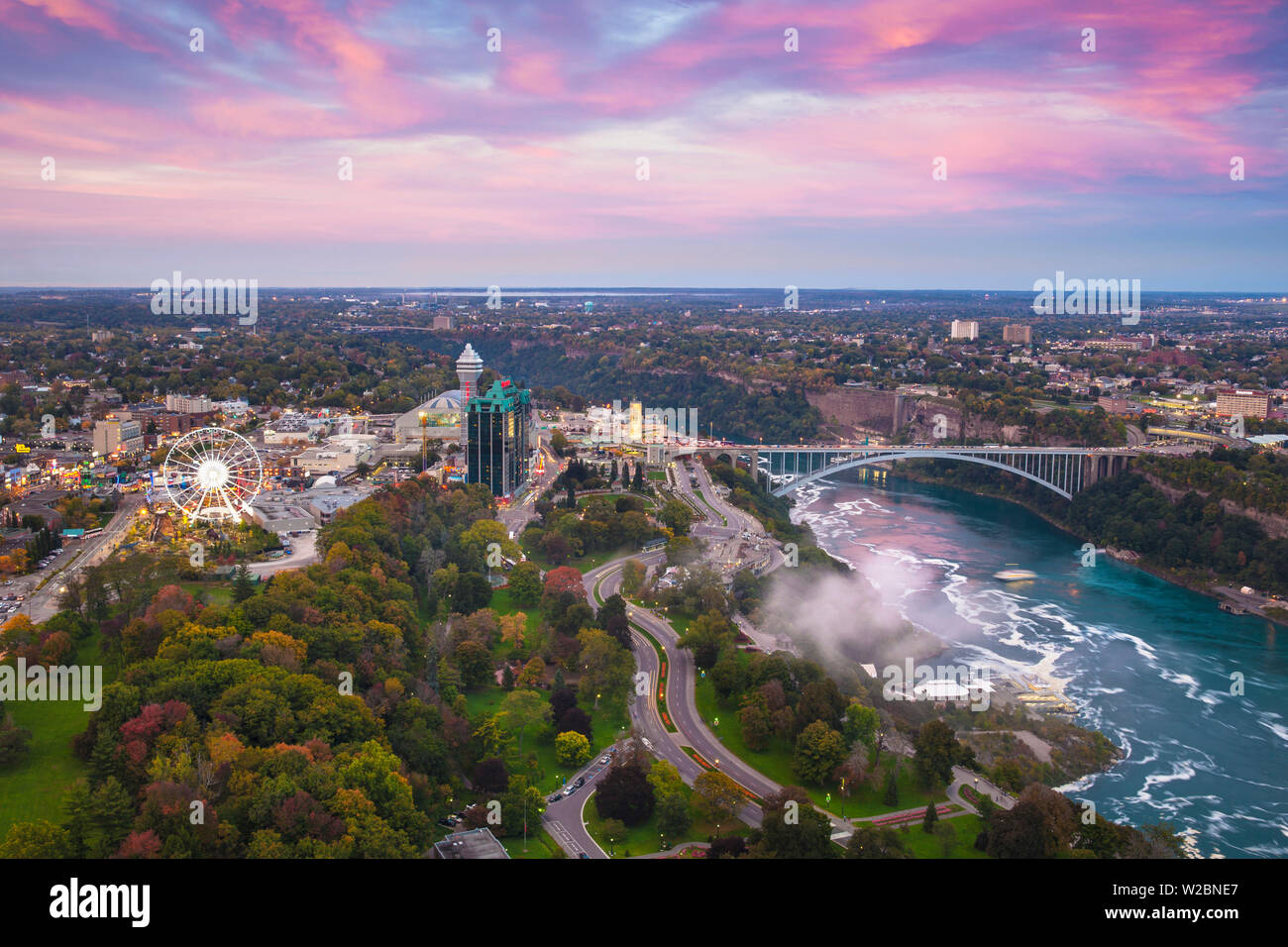Canada and USA, Ontario and New York State, Niagara, View over Victoria Park towards the Sheraton on the Falls Hotel and Rainbow Bridge Stock Photo