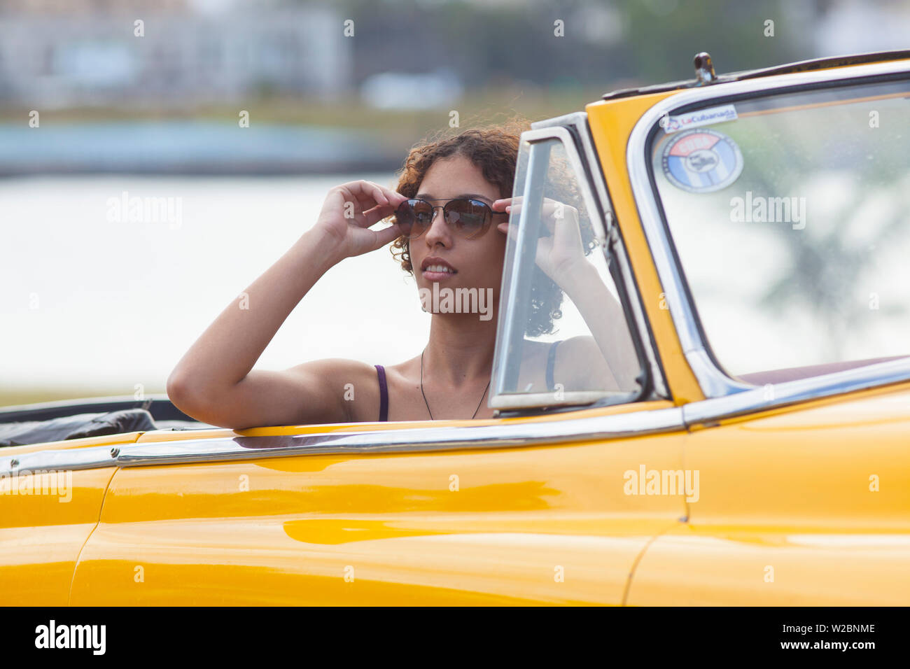 Young woman in a Classic 50's Chevrolet, Havana, Cuba (MR) Stock Photo