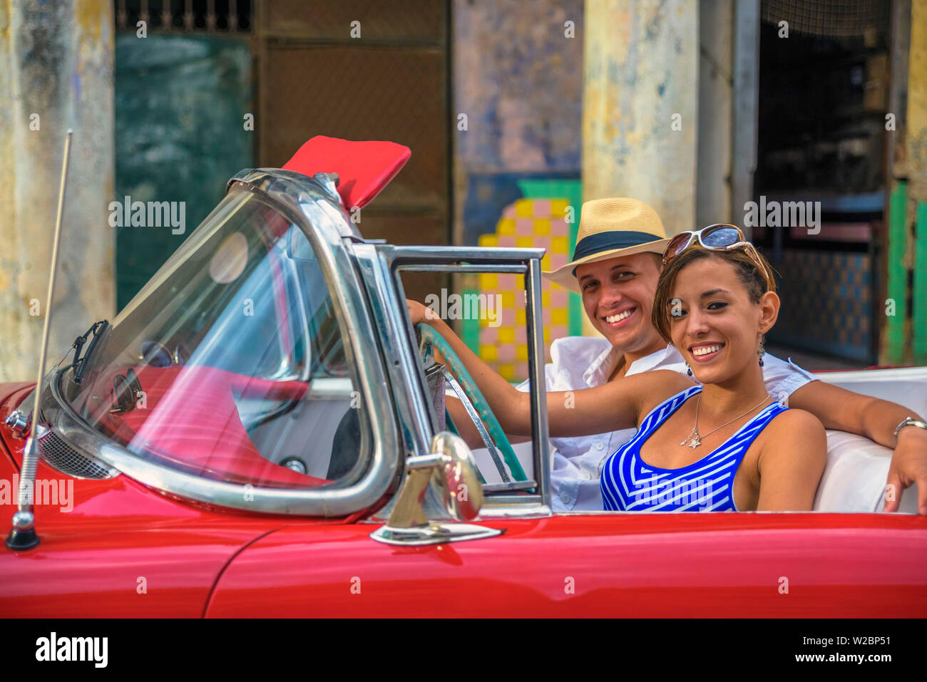 Cuba, Havana, La Habana Vieja, Tourists enjoying 1950's classic American Buick (MR) Stock Photo
