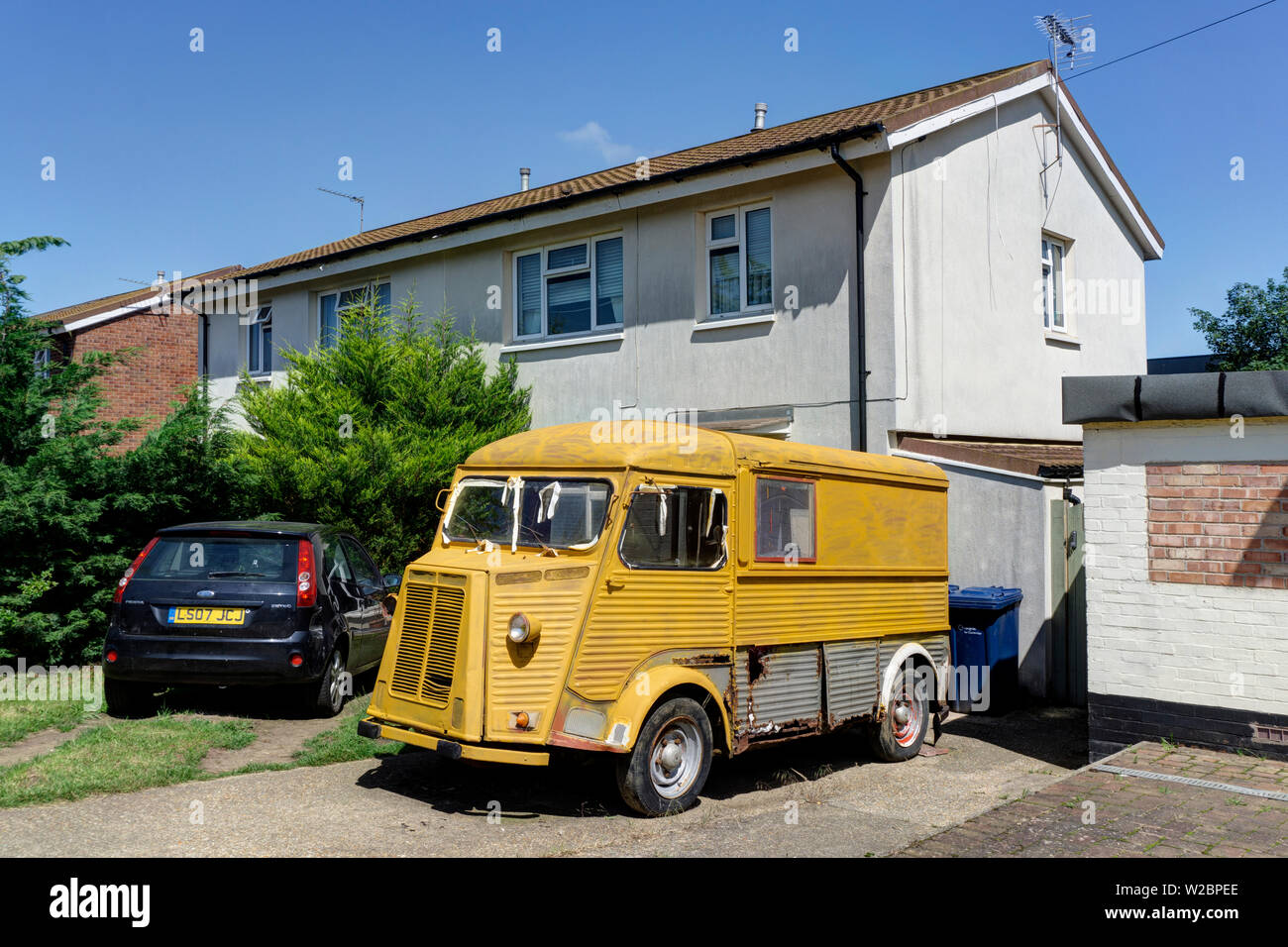 vintage citroen yellow corrugated van parked out side former council estate  UK england Stock Photo - Alamy