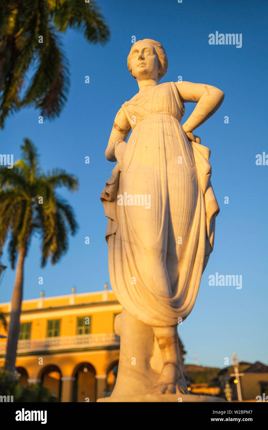 Cuba, Trinidad, Statue of the Greek muse Terpsicore at Plaza Mayor with Brunet Palace now the Museum Romantico in the background Stock Photo