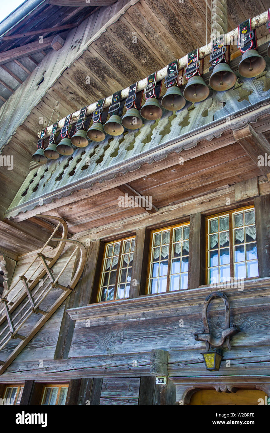 Old chalet with display of cow bells, in the Emmental Valley, Berner Oberland, Switzerland Stock Photo