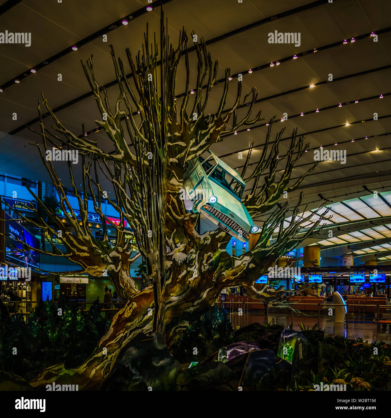 Singapore - Dec 24, 2018: Rare replica of the magical tree set up at Terminal 2 Departure Hall. Stock Photo