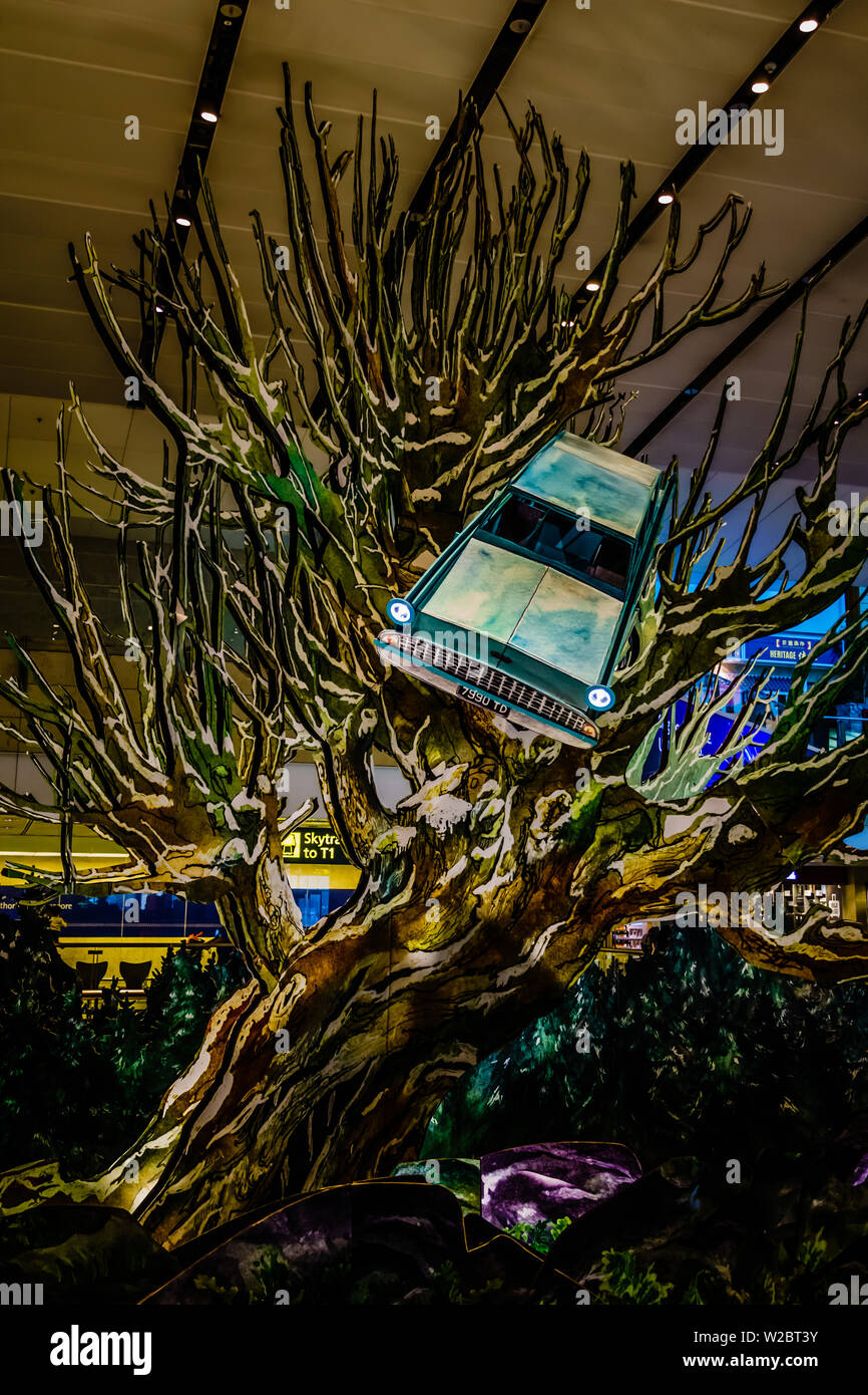 Singapore - Dec 24, 2018: Rare replica of the magical tree set up at Terminal 2 Departure Hall. Stock Photo