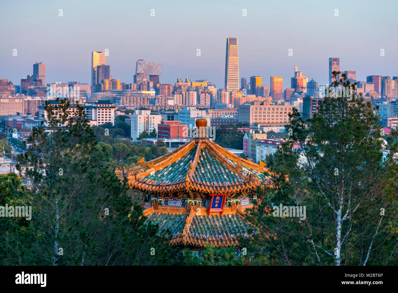 China, Beijing, Jingshan Park, Pavillion and Modern Chaoyang District skyline beyond Stock Photo
