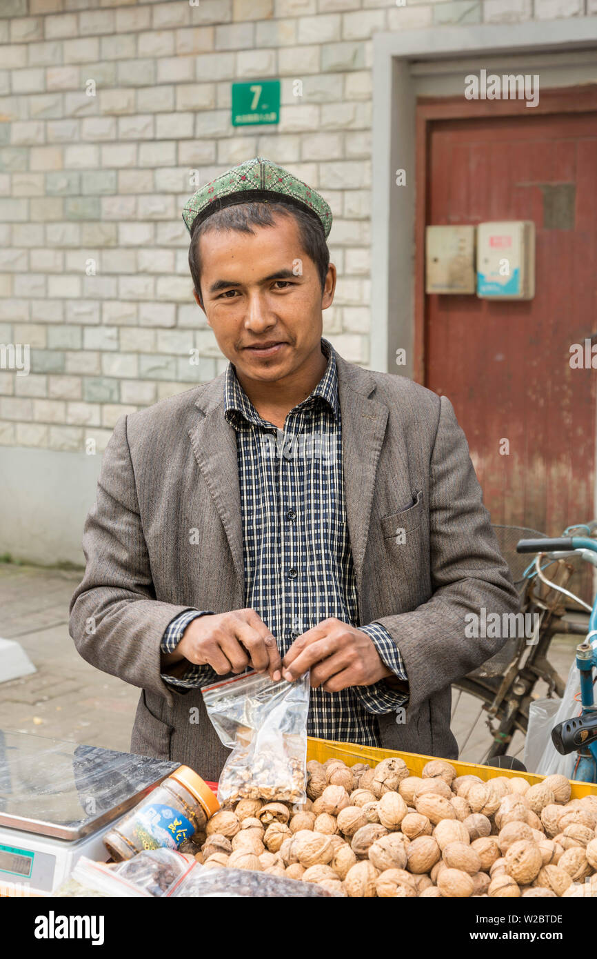 Men from Xinjiang selling dried fruit, French Concession, Shanghai